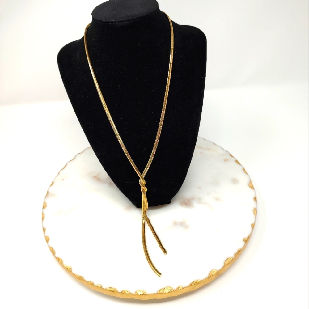 Elegant gold tone twist long necklace
